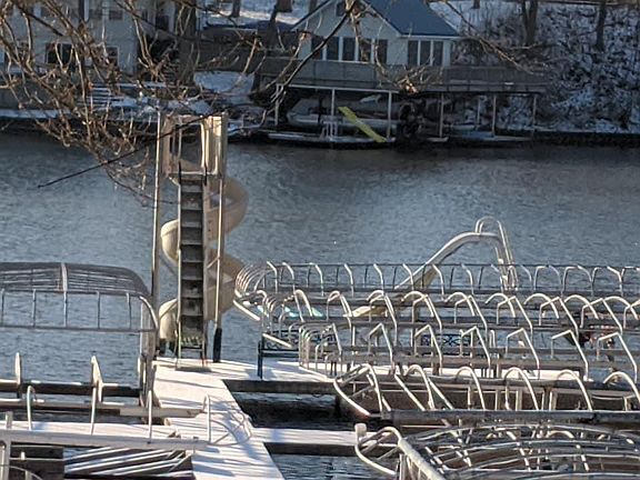 Shared dock. Excellent for swimming using both water slides & the floating swim platform that is out in the summer. Benches on the end of the pier. Friendly cottage community neighbors in the summer on weekends.