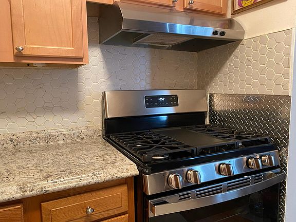 NEW Stainless Steel Fridge & Stove, NEW Counters, Ceramic tile floor,ceramic backspash