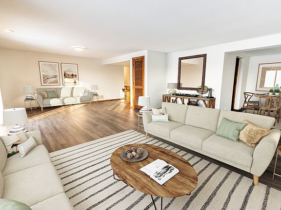 Elevate your lifestyle at Central Lakes of Uptown. This spacious living area features stylish decor, sleek wood flooring, and ample natural light, creating a warm and inviting atmosphere. Don't miss the chance to call this homeAAAaAAaAschedule your visit 