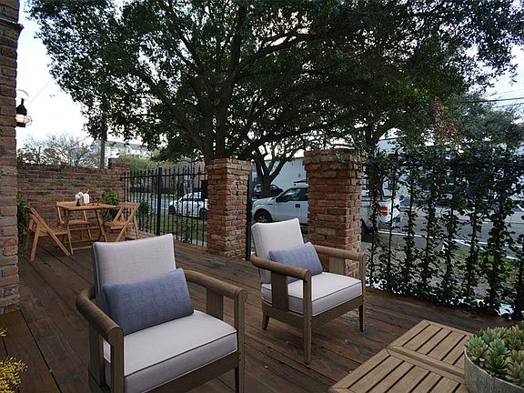 Another view of the front courtyard/deck which has been virtually staged. What a perfect spot to dine al fresco and entertain your guests!