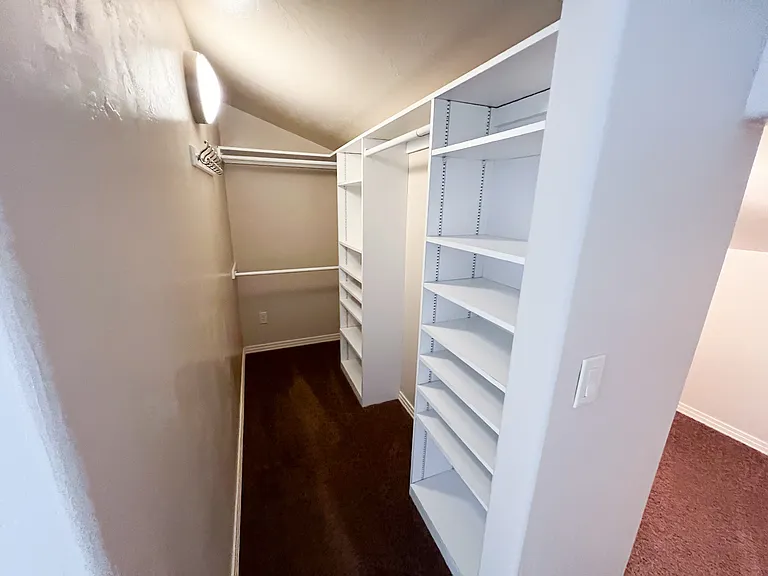 Primary bedroom closet 1