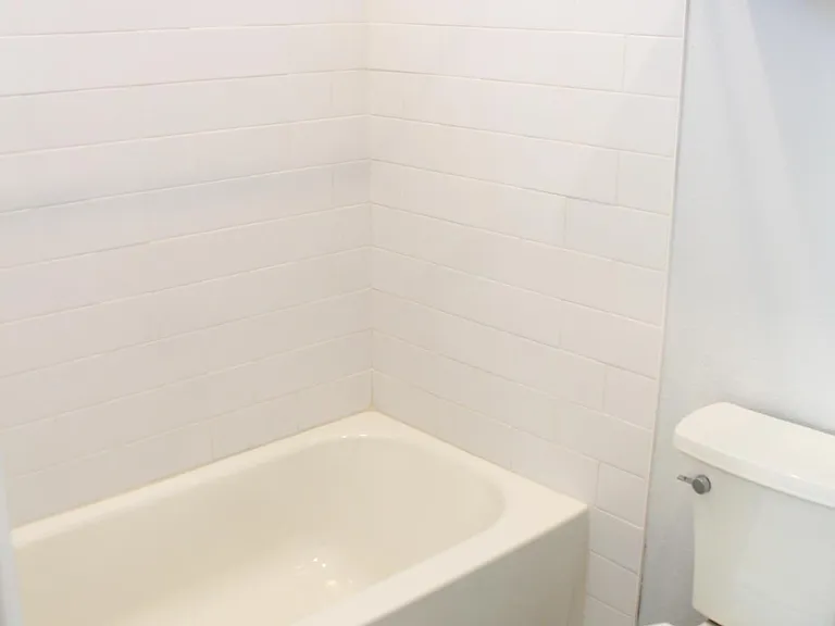 Spacious bathtub. Not shown is an exhaust fan that includes a separate switch for heater.