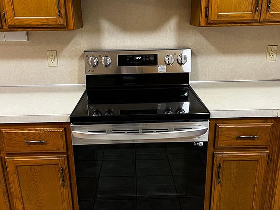 New stainless steel stove and vent hood.