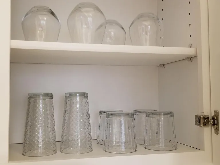 Glasses for four, including wine glasses.