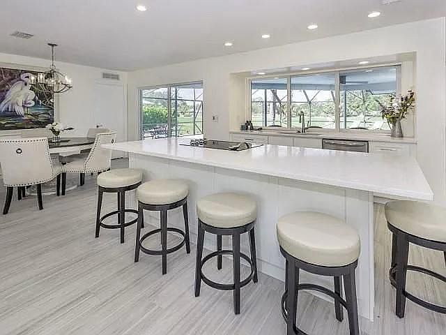 Wide open living space, opens to pool and golf course!