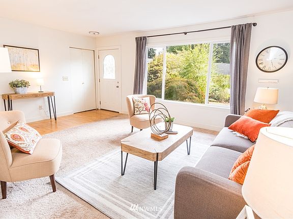 The front living room area and entry way with coat closet