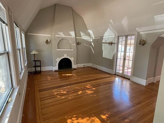 Large living room, with amazing vaulted ceilings and tons of natural light.