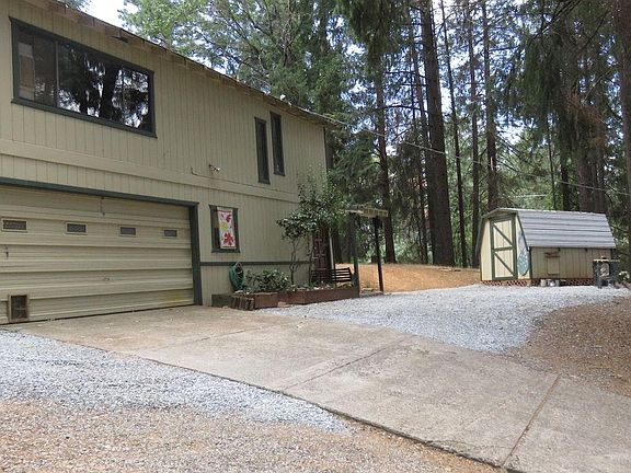Front of home and storage shed