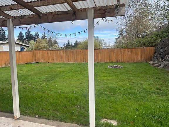 Backyard fully fenced, one side regular gate access 1 side large gate access.