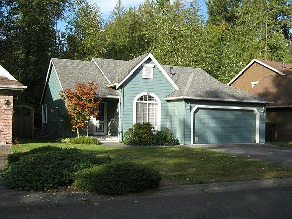 Front of the home showing the private wooded area behind the home.