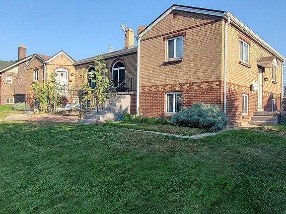 Apartment is in lower right corner and accessed via stoop on the right side.