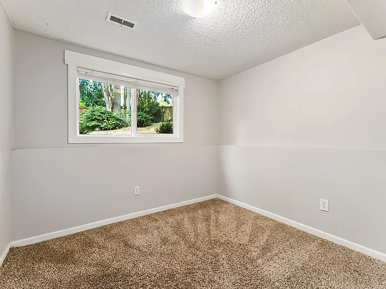 Lower Level Bedroom, updated with LVP Flooring.