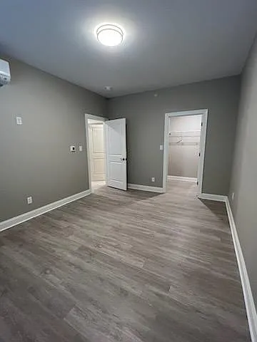 Lower Large bedroom /Vinyl flooring & large walk in closet & spacious first floor bathroom & storage closet