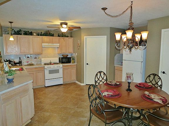 The kitchen has upgraded light fixtures, a gas range and lots of counter space.