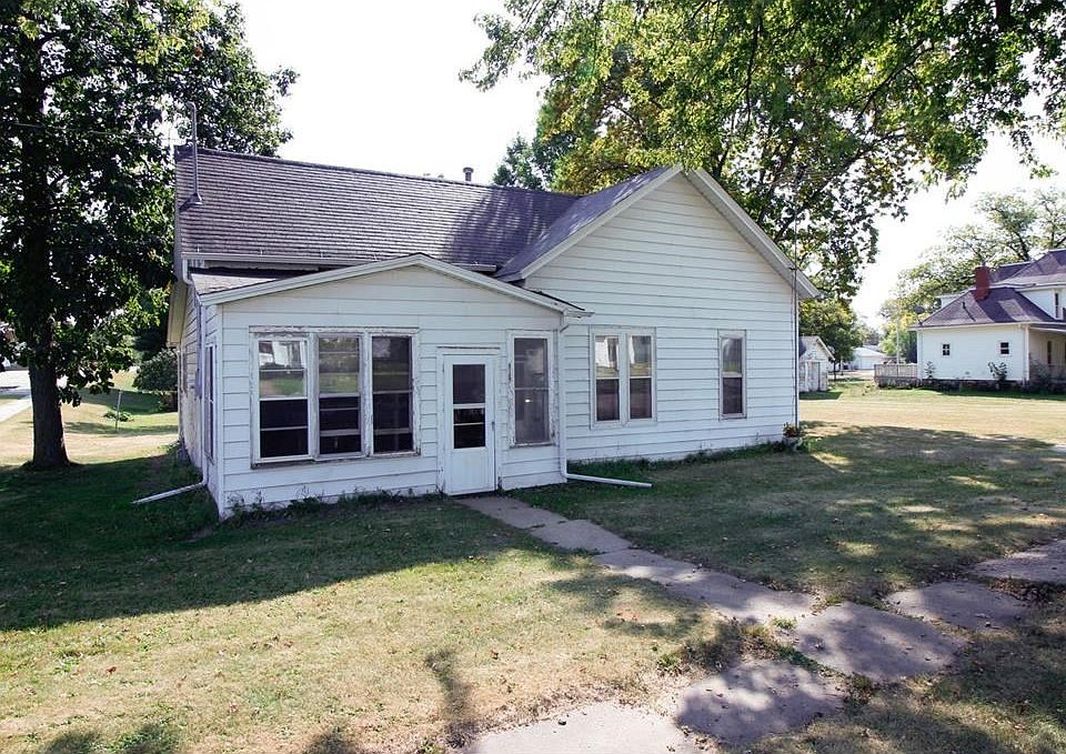 House front viewed from West looking East. Area visible to South (right of house) is and adjacent lo