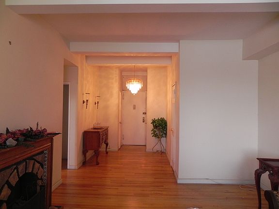 Welcoming entryway wih three closets.