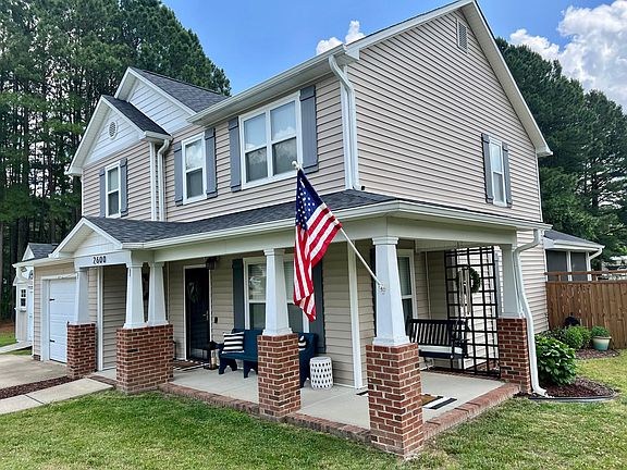 Wrap around front porch welcomes you in!