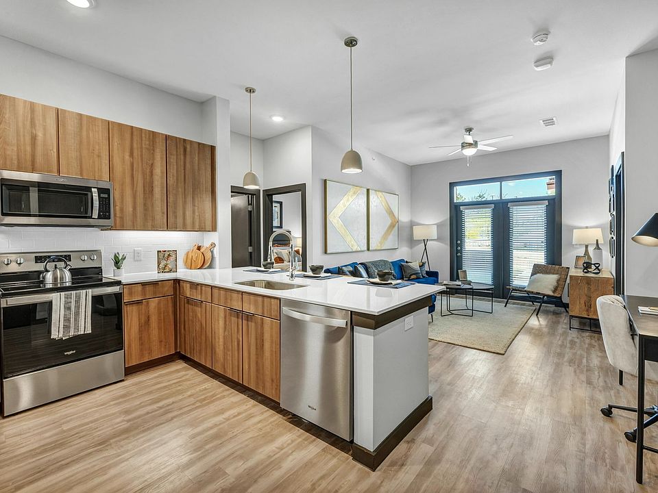 Greeted by the large kitchen and living room as you enter