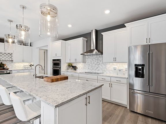 Open concept kitchen with stainless steel appliances