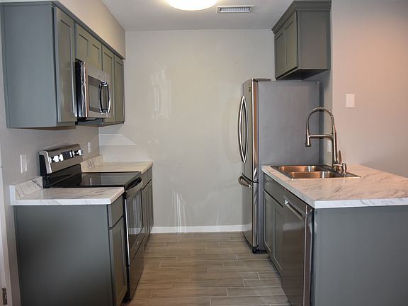 Full kitchen with stainless steel appliances and dishwasher