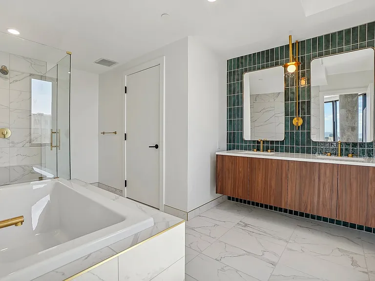 Luxurious bathroom with tub, shower and dual undermounted sinks