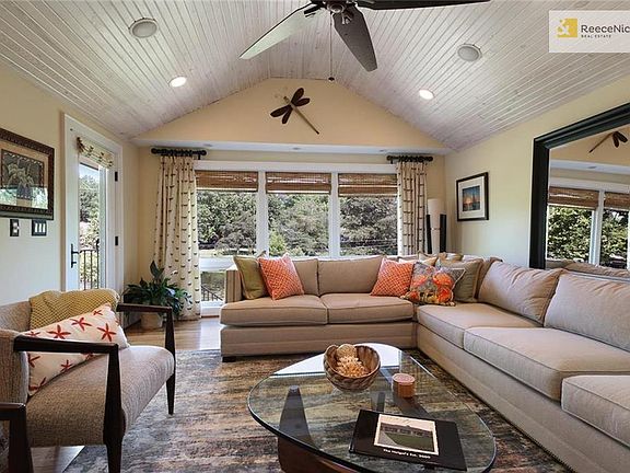 Living room with surround sound walks out to trex deck.
