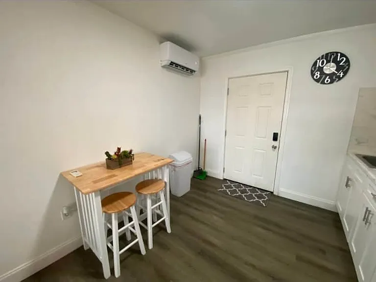 Warm dining area for two with AC and decorative clock