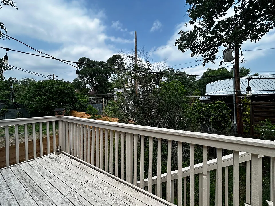 Deck off of Primary bedroom. Stairs lead to back yard.