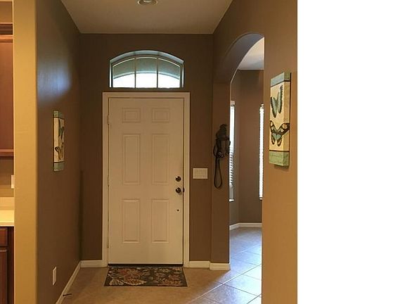 Inside Entryway.  Dining room on right. Kitchen to left.