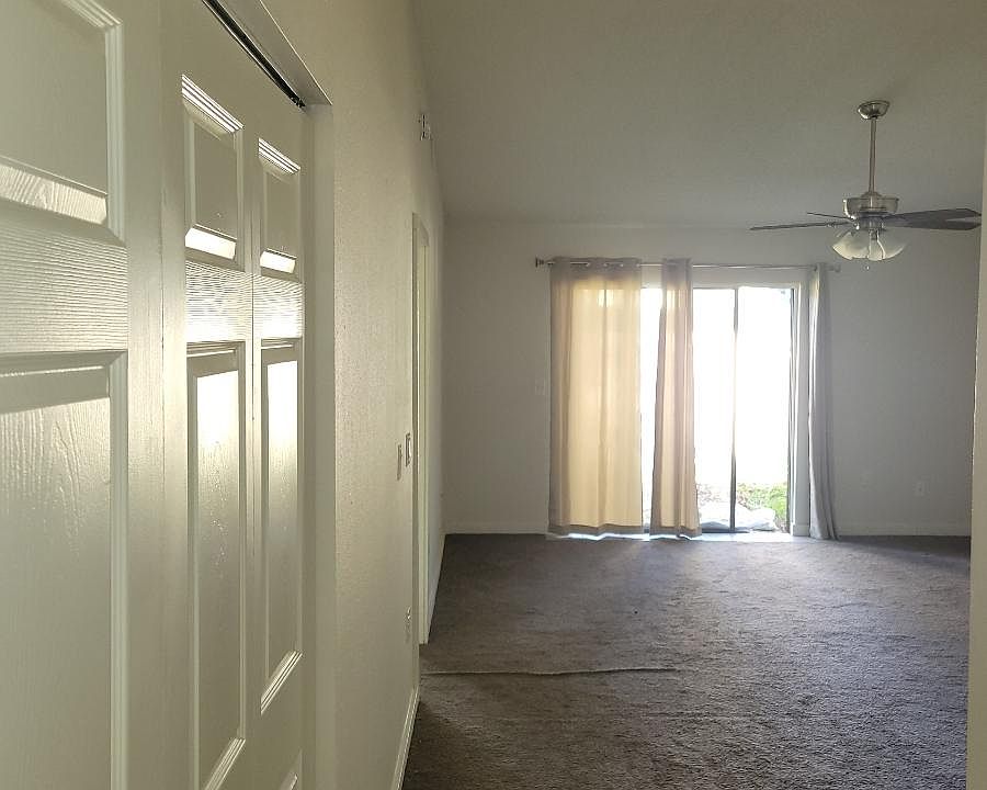Living room & indoor laundry room with washer/dryer hookups