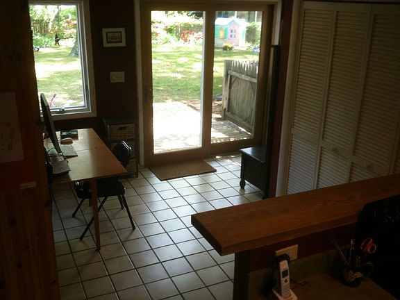 Eat-in kitchen with washer and dryer, patio in back yard