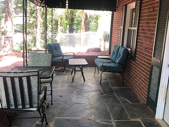 Private covered patio entrance to unit