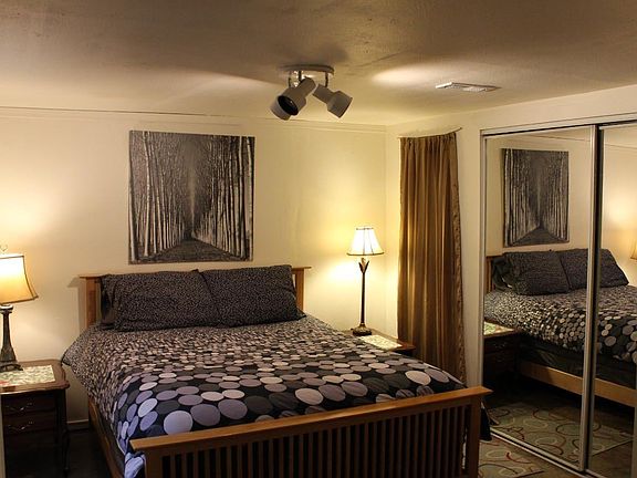 Cozy  bedroom with comfy pillow top queen size bed.