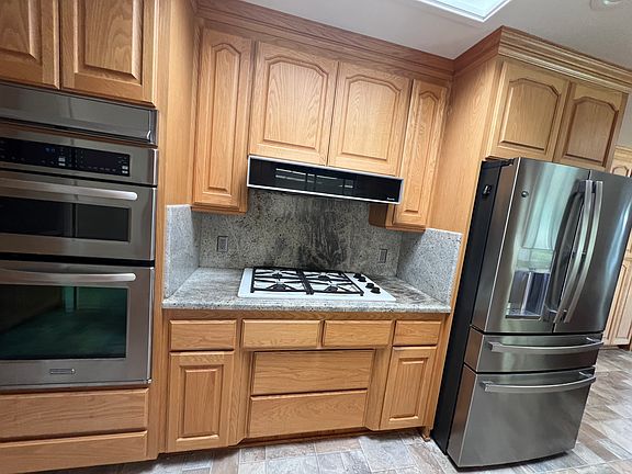 Kitchen - granite counters, maple cabinets.
