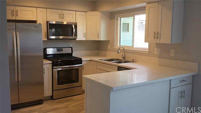 Remodeled kitchen with granite and new appliances. Yes the refrigerator is included.