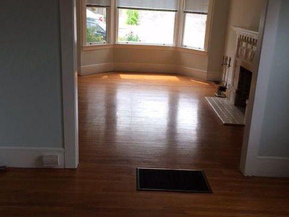 Wonderful hardwood floors! without furniture from dining room to front room