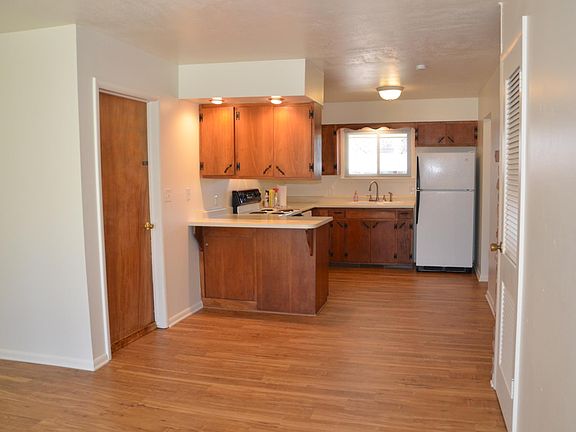 Kitchen with door to the garage and open to the dinning room