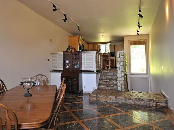 Kitchen is lofted and look down onto 2 story livingroom.