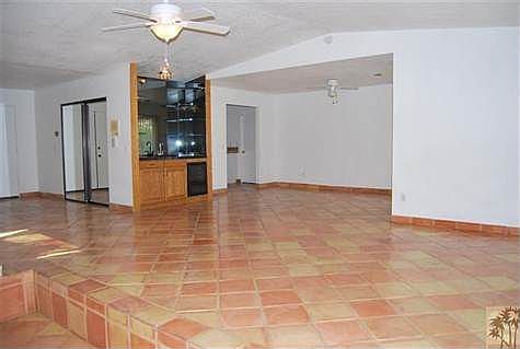 Another living room view with wetbar and dining area.