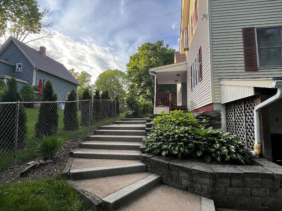 View from side yard next to large driveway