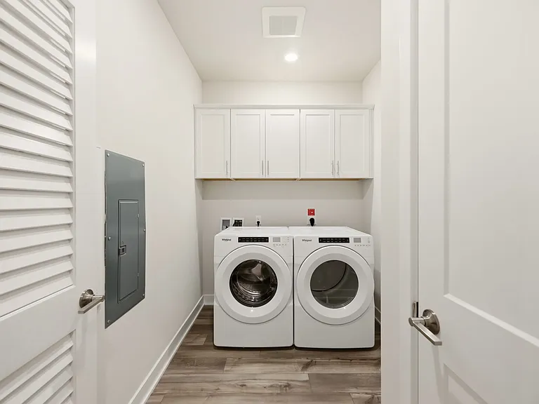 Laundry Room with Washer and Dryer Included - Closed Cabinets over Washer and Dryer