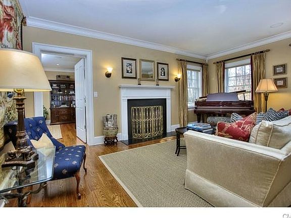 Large living room with one of three fireplaces in the home.