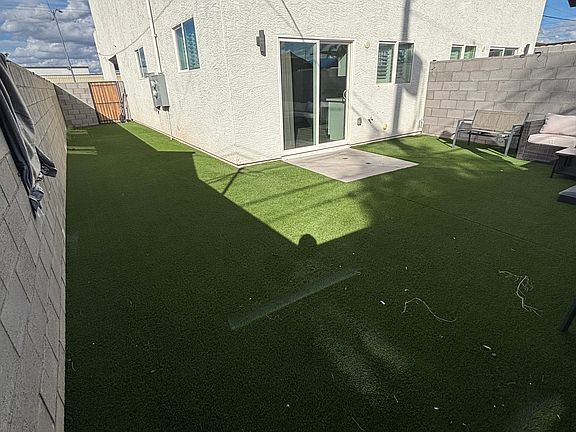 The backyard and side yard (patio furniture included)