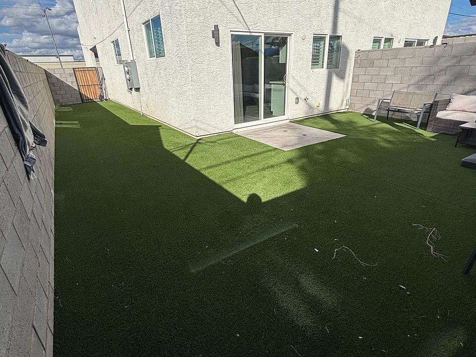 The backyard and side yard (patio furniture included)