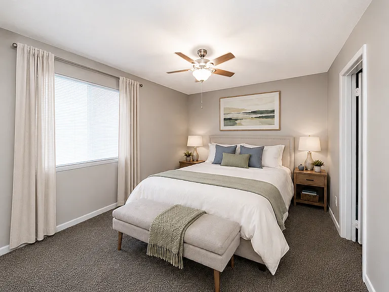 Cozy bedroom with carpet & ceiling fan