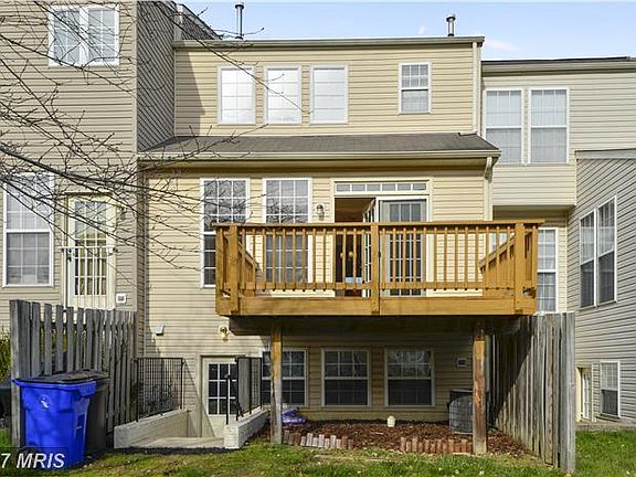 Walk up Stairs - 1 door and 3 windows to back yard