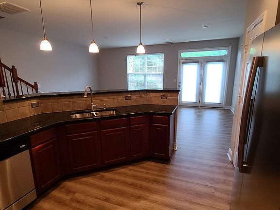 Kitchen with view of back patio door access