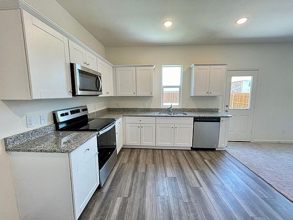 kitchen with granite countertop and stainless steel appliances