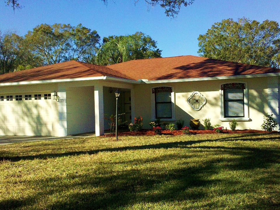 Front view with extra long driveway.