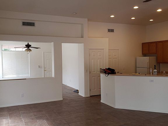 Older picture of dining room and kitchen looking into the living room at front door